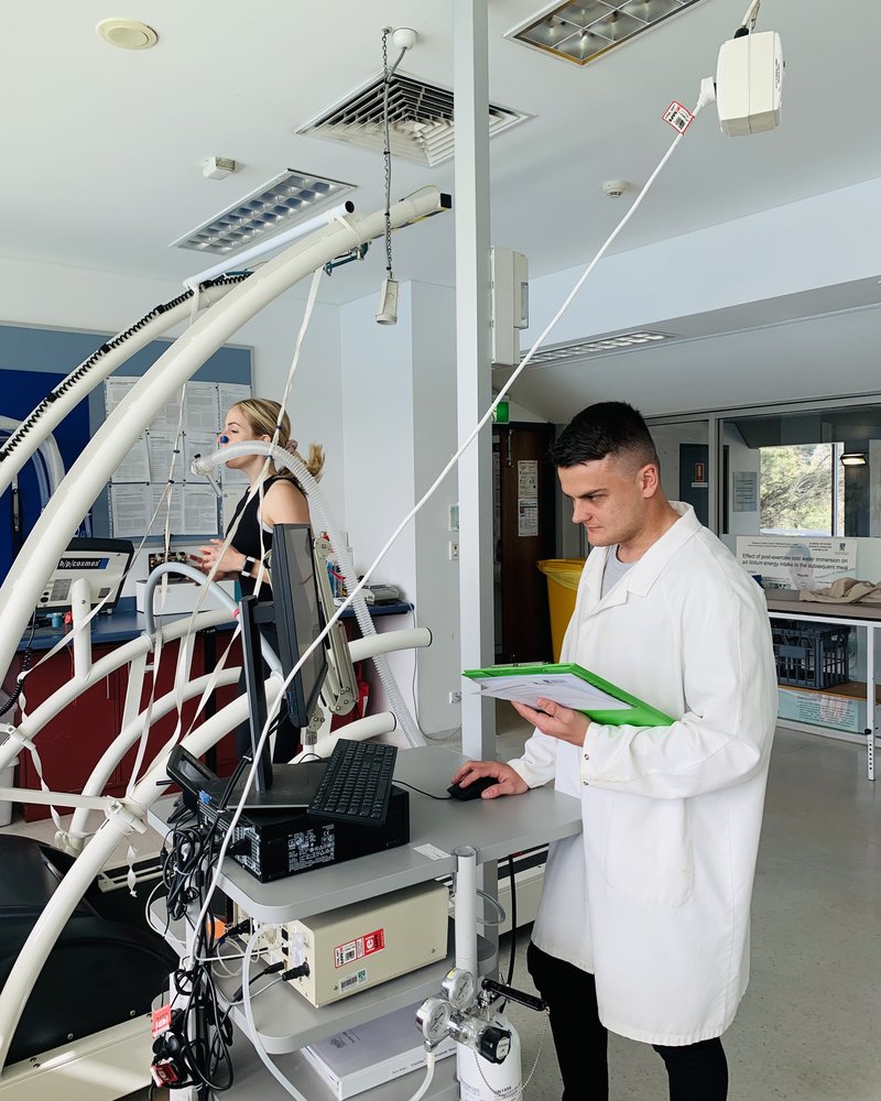 Dr. Cory Dugan conducting exercise physiology testing in the lab